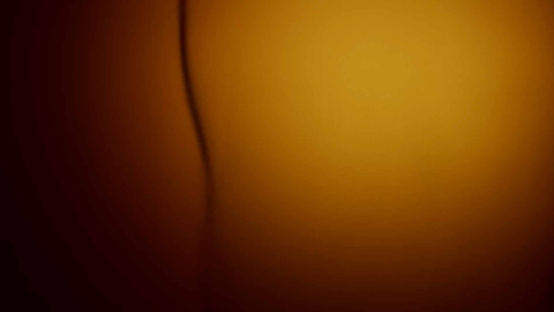 An abstract background with a warm orange gradient