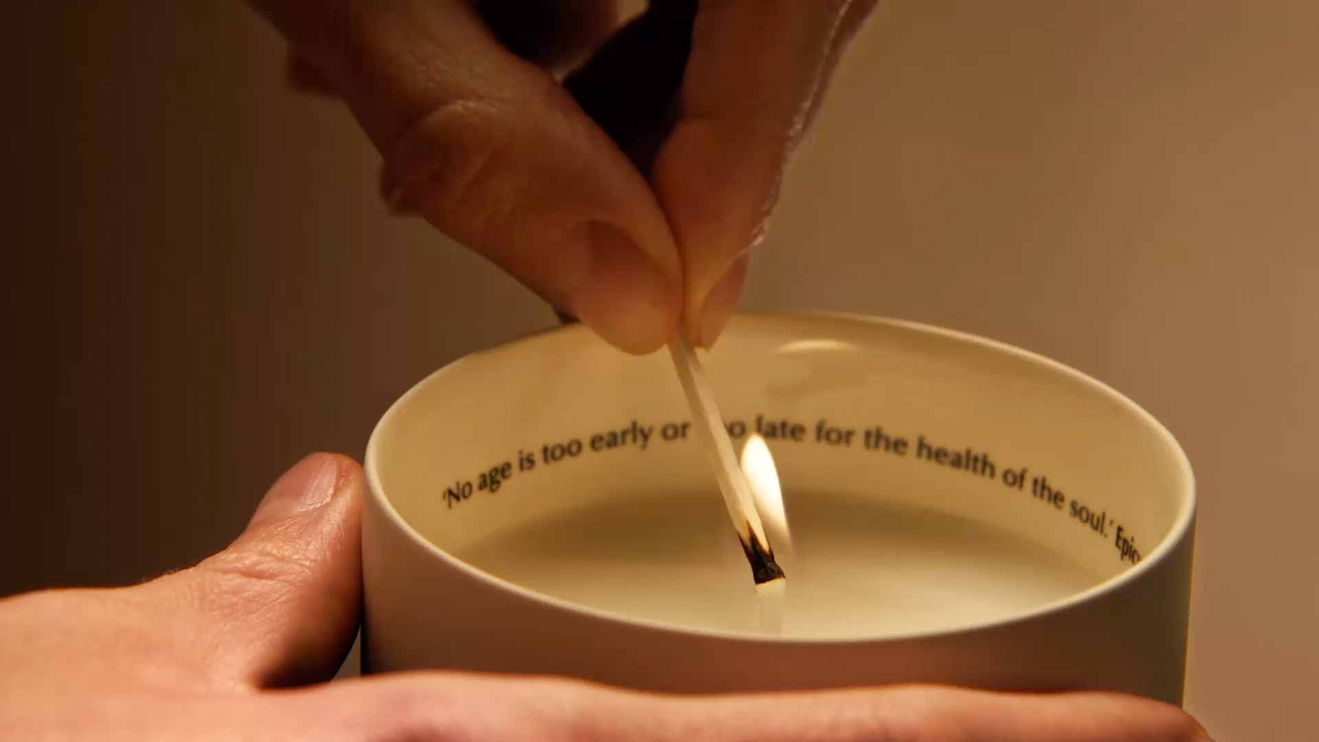 Lighting up candle with a match