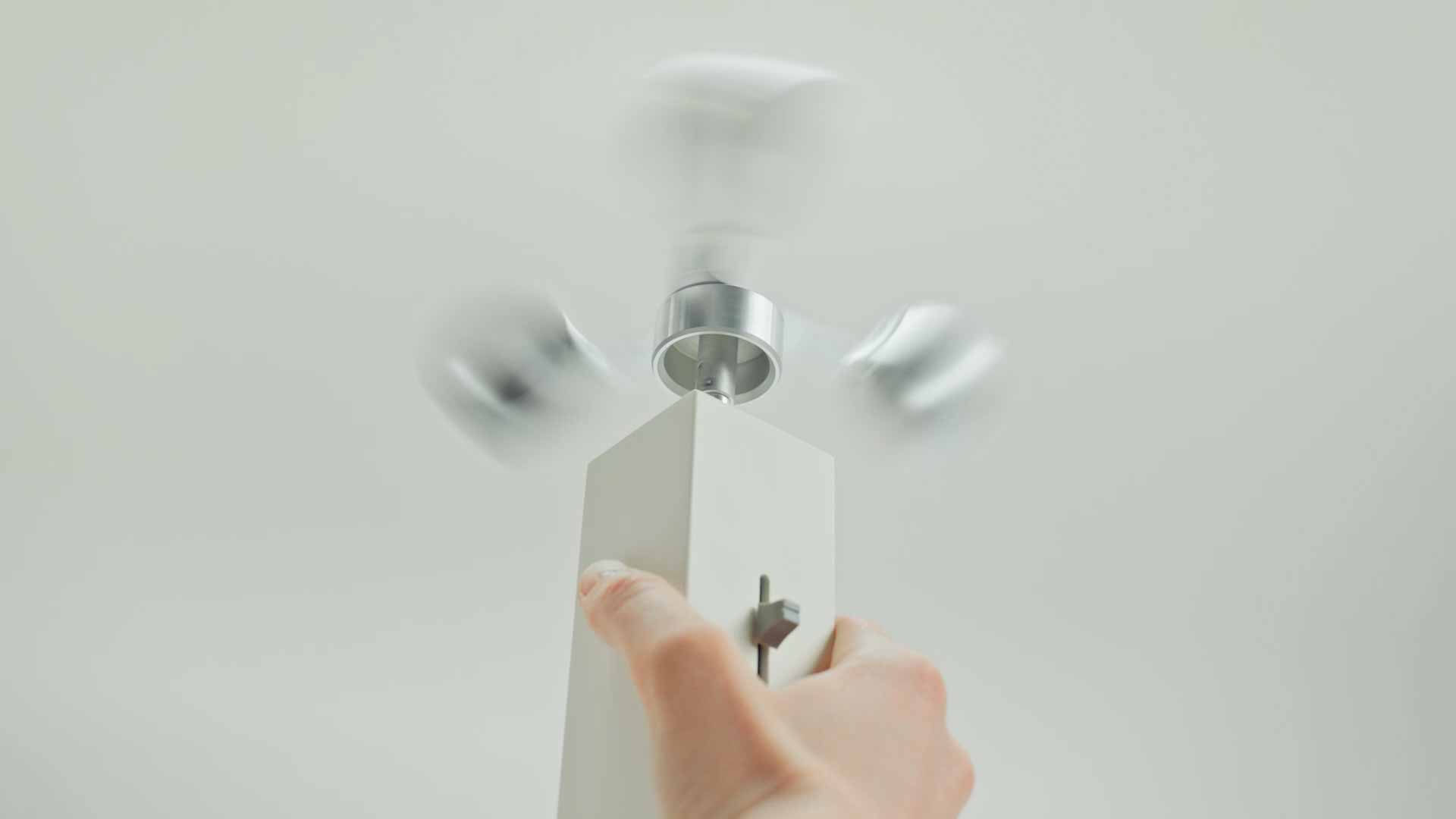 A person holding a gadget for detecting scents